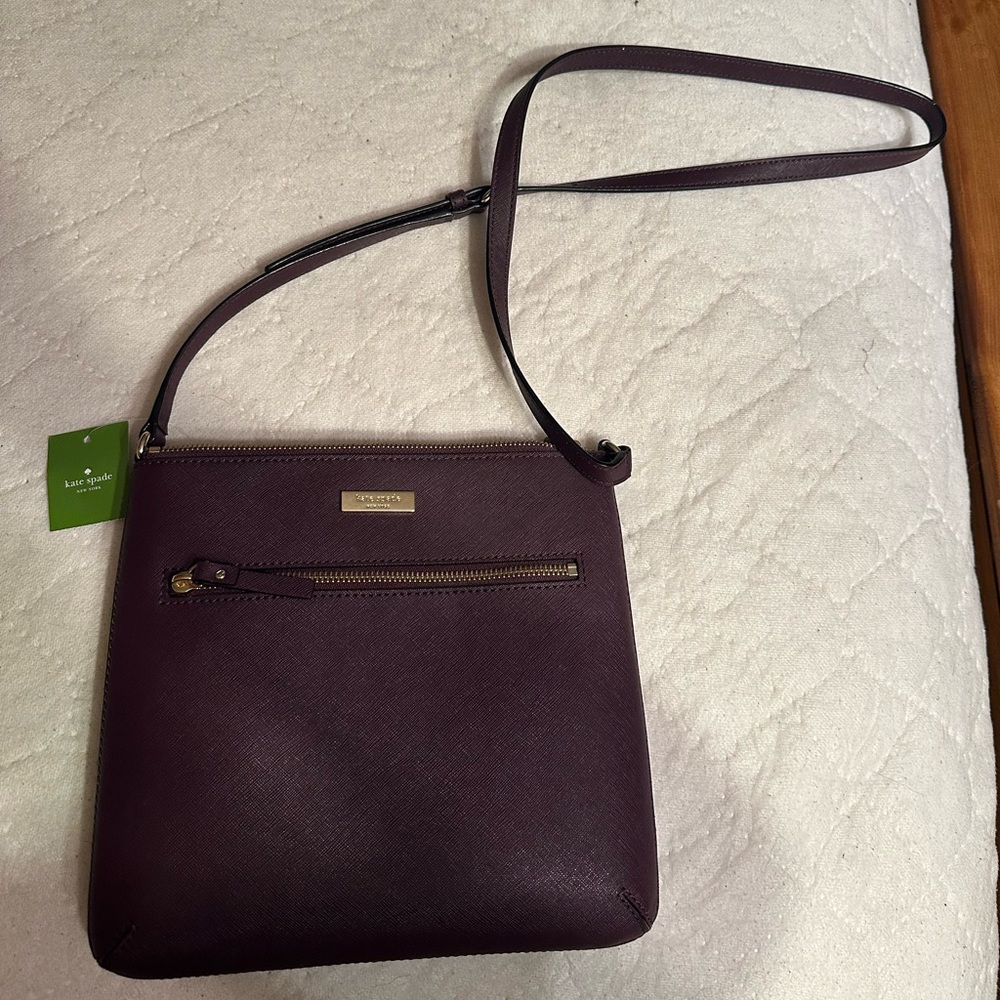 Brand new Kate Spade Purse in the color burgundy/plum